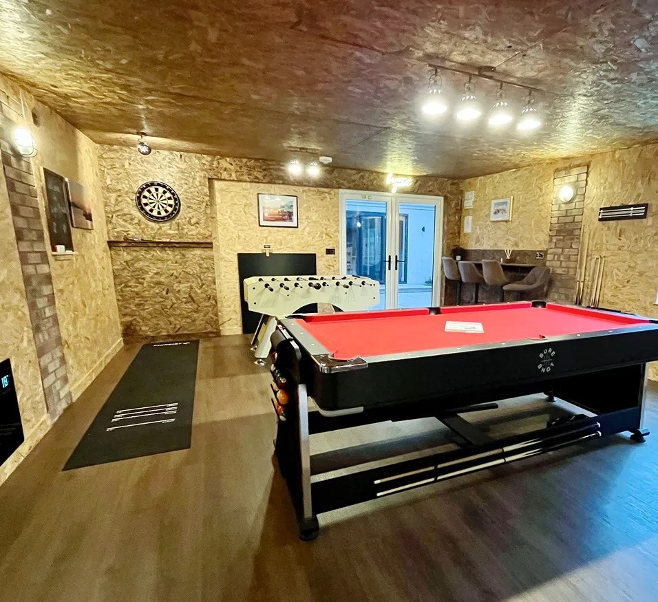 Large games room at High Beach Holidays in Berrow with pool table, air hockey and dartboard