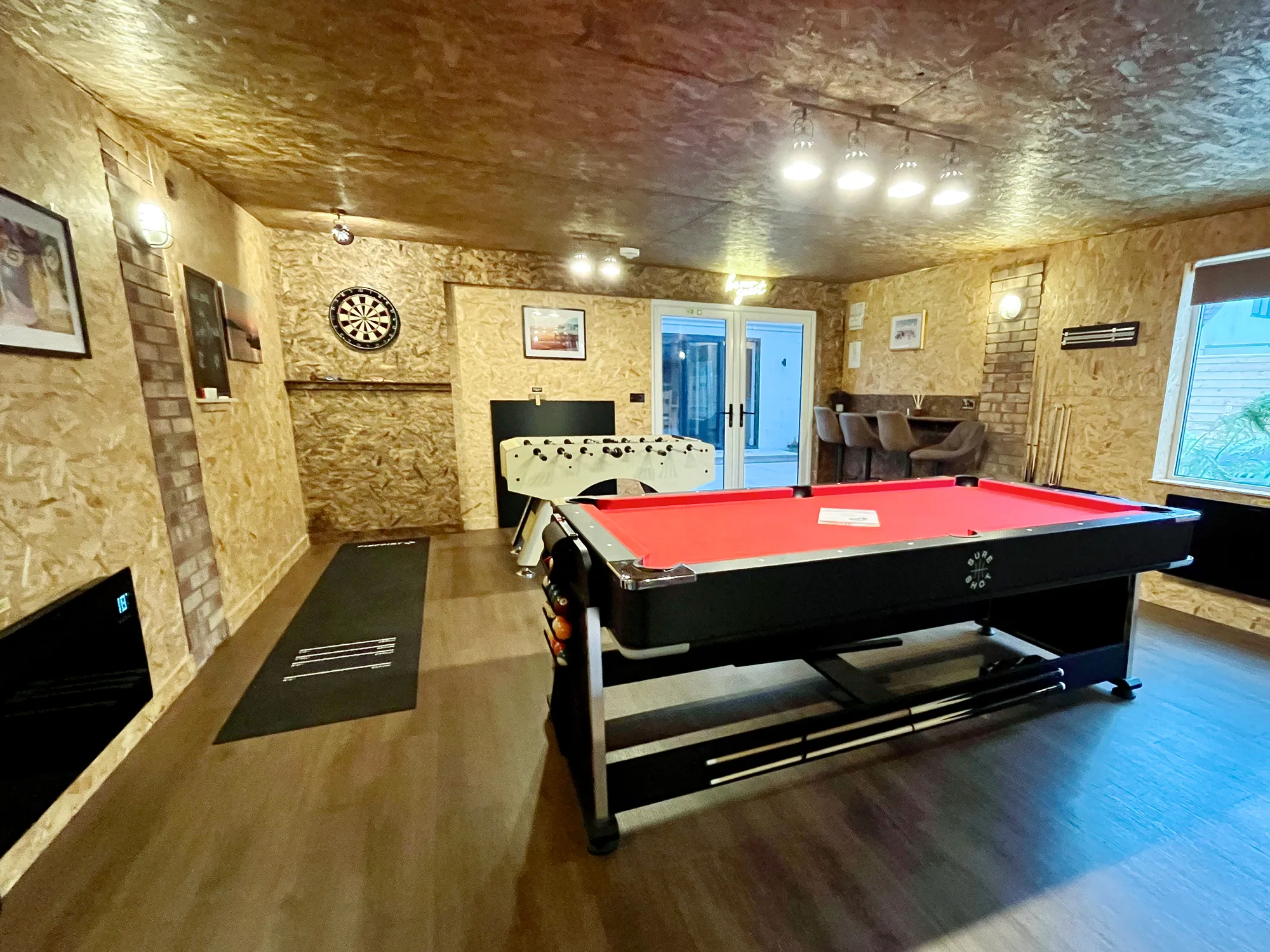 Large games room at High Beach Holidays in Berrow with pool table, air hockey and darts